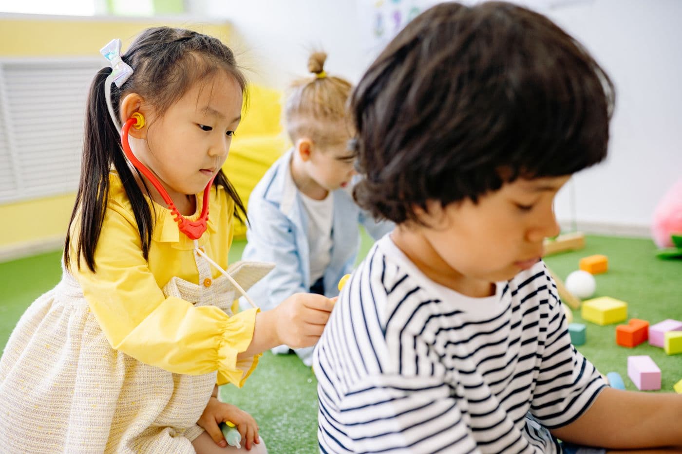 Placeholder photo of young children in a play-based classroom